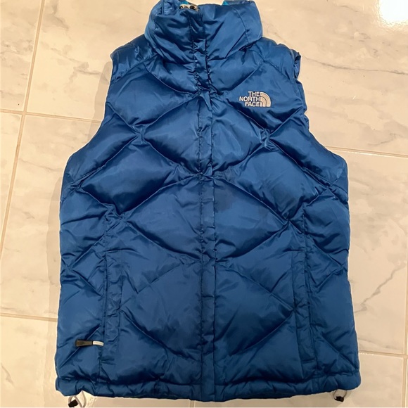 The North Face Jackets & Blazers - The North face blue puffer vest.  Goose down filled.  Zip up. EUC!